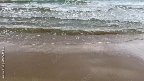 Moody early morning sea with rolling waves