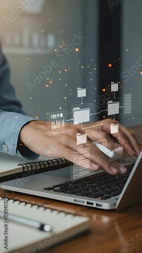 Data Management with a Laptop: a businessperson uses digital document icons for efficient file organization and analytical charting for increased work productivity.