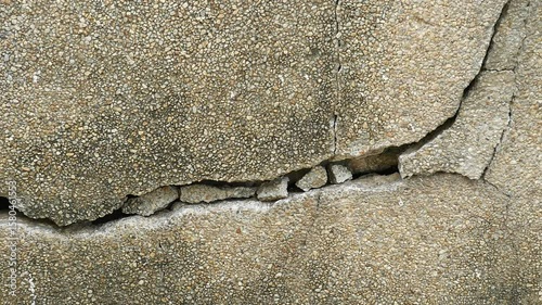 Old concrete wall texture large crack and dirty wall surface with large damage.