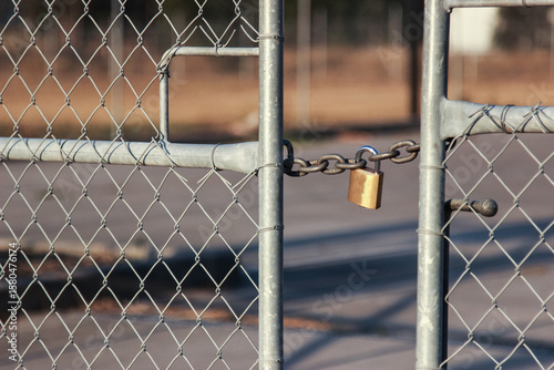 Short chain and lock holding gates shut