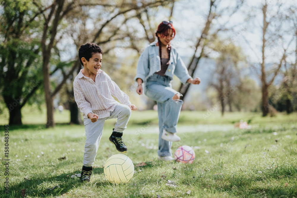 Obraz premium A cheerful moment of a mother and her child playing ball games together in a lush park, surrounded by trees on a sunny day, showcasing joy, connection, and outdoor recreational activities.