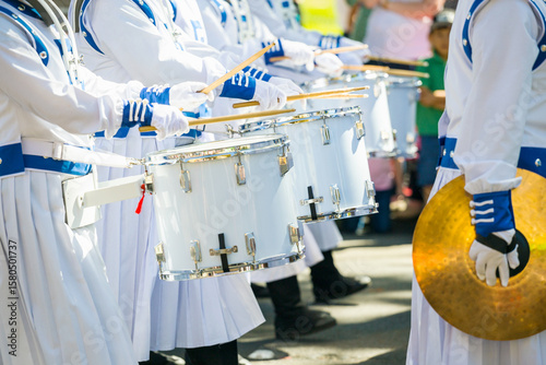 A row of drummers in a marching band