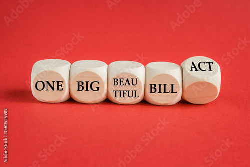 Cubes form the expression One big beautiful bill act. Beautiful red background. Business concept. Copy space.