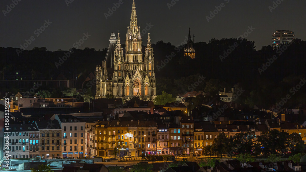 Naklejka premium Aerial view of Notre Dame de Laeken church spires night timelapse in Brussels, Belgium.