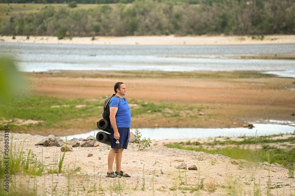 A man with a backpack walks through the forest and the beach and does sports
A man with a backpack walks through the forest and the beach and does sports