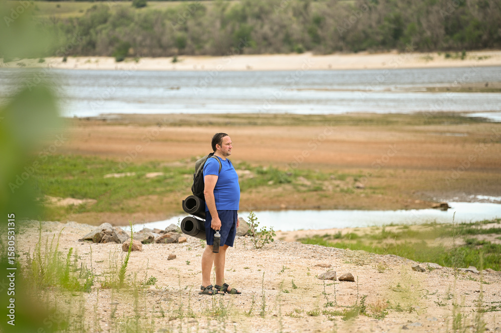A man with a backpack walks through the forest and the beach and does sports
A man with a backpack walks through the forest and the beach and does sports