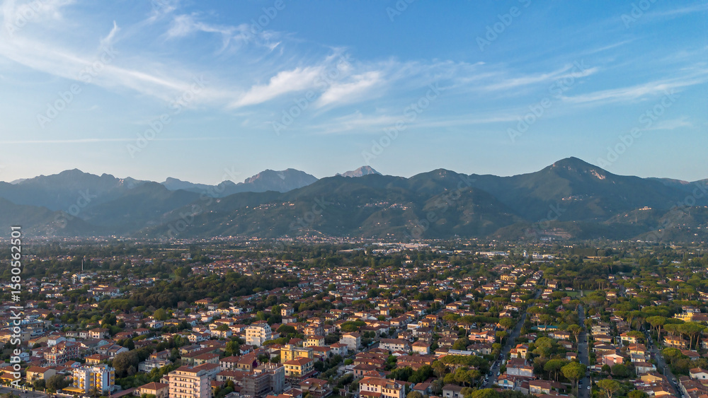 Fototapeta premium Viareggio, Italy. View from above of the city and mountains from the sea. Tourist resort town, Tyrrhenian Sea. Aerial View