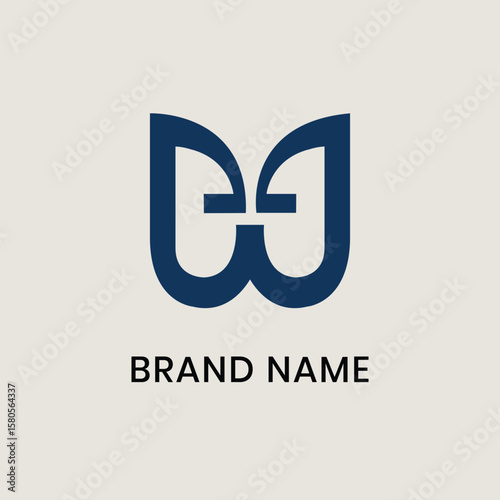 A modern and elegant logo in the letter W that incorporates a stylized butterfly motif