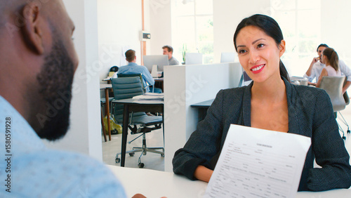 Fotografie Woman Attending Job Interview In Modern Open Plan Office