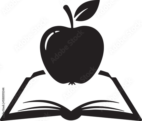 Black apple resting on an open book symbolizing knowledge education and learning