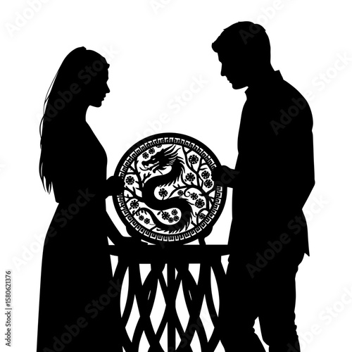Silhouette of couple admiring dragon motif lacquerware, decorative artistry