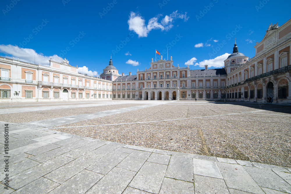 Fototapeta premium Historical architecture of Royal Palace in Aranjuez, Spain under a clear blue sky