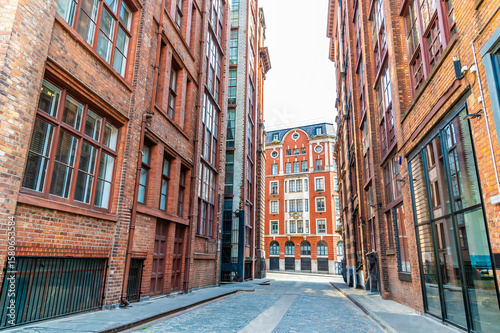 A view down a side street forming an urban canyon  in Manchester,UK in summertime