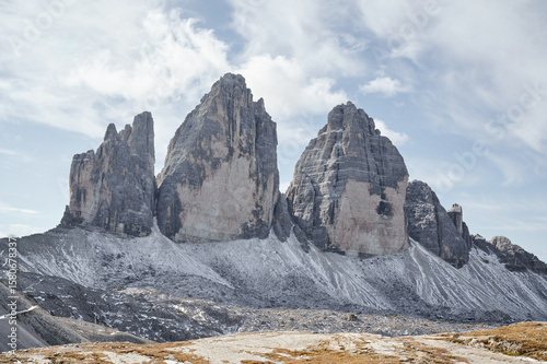 tre cimes in the dolomites with blue sky and clouds