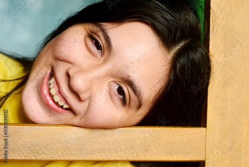 Happy teenager girl smiling joyfully.