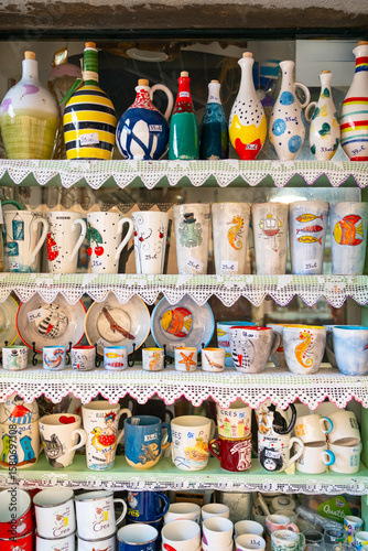 Photography Colorful ceramic mugs and pottery in souvenir shop in Cres, Croatia