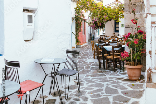Cozy cafe terrace in Plaka village, Milos island, Greece