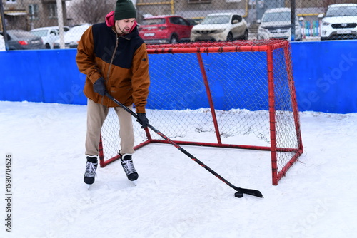 Photography People skate and play ice hockey in the yard