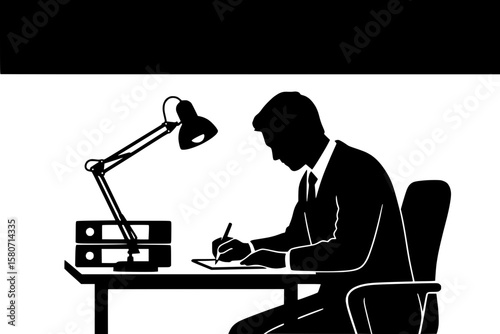 Man writing notes at work desk with lamp