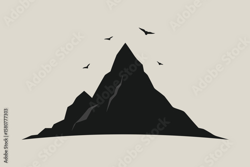 isolated granite peak with circling birds above