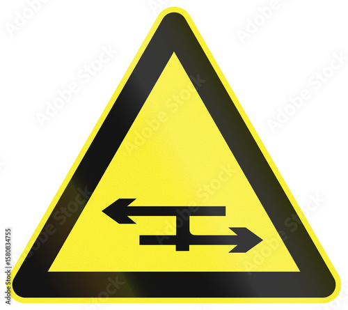 Warning road sign in China - T junction with a dual carriageway