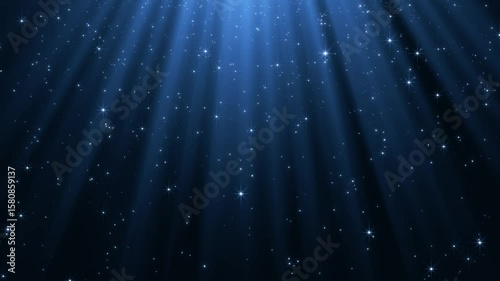 christmas and new year blue motion background with shiny stars glitter and particles falling and light flare, social media design element