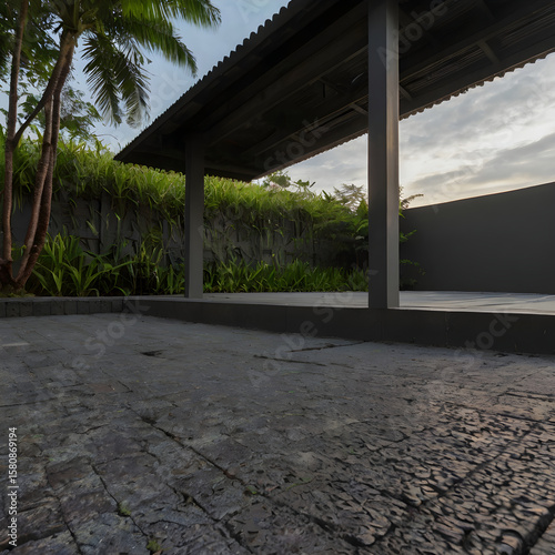 Modern Architectural Design with Stone Pavement and Greenery Under a Shelter