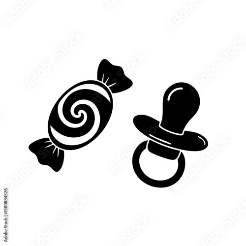 Candy and pacifier on a clean background, representing a baby's needs. 