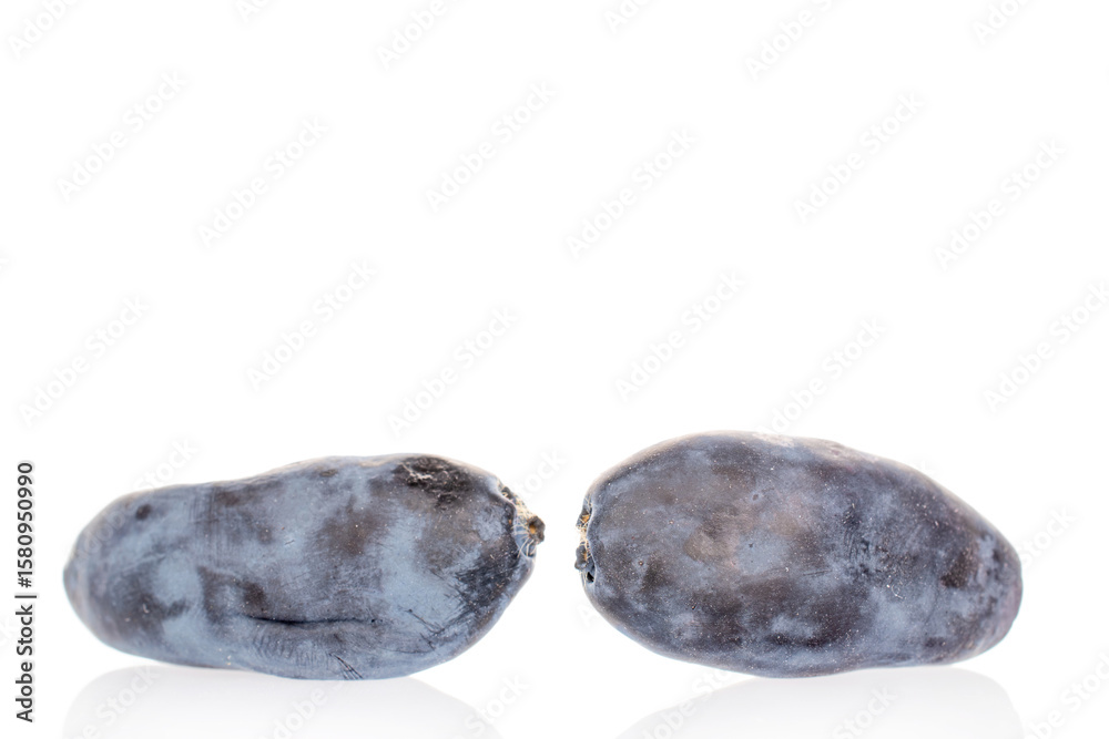 Obraz premium Sweet honeysuckle berries isolated on white background, top view.