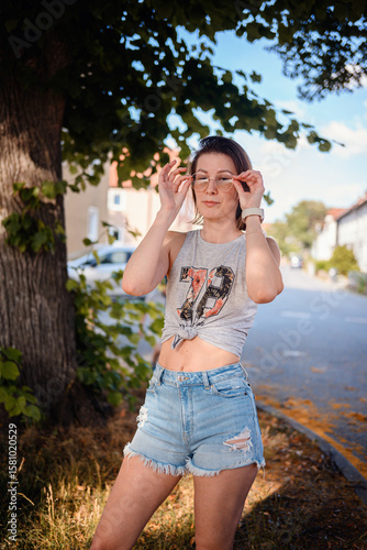 Confident Young Woman Posing in Casual Summer Outfit
