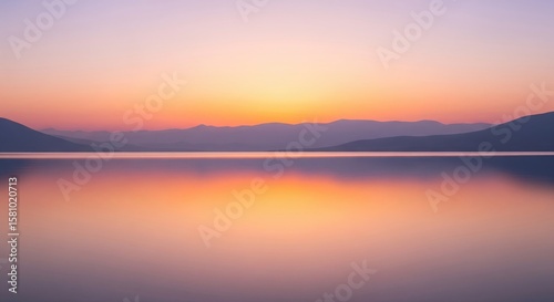 Scenic Landscape Of Sunset Over Calm Water Surfaces
