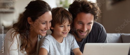 Happy Family Watching on Laptop Together at Home