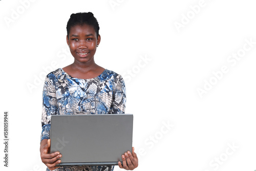 Young teenage girl standing, holding a laptop.