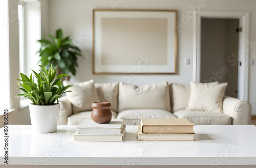 Modern living room interior with beige sofa and minimalist decor on white table. 