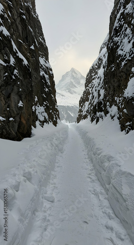 Snowy mountain path leading to majestic peak winter wonderland breathtaking view scenic landscape