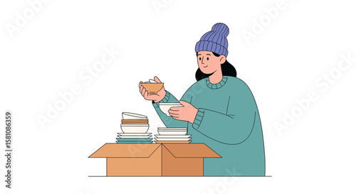 Young Woman Preparing Winter Donations for Charity in Cardboard Box