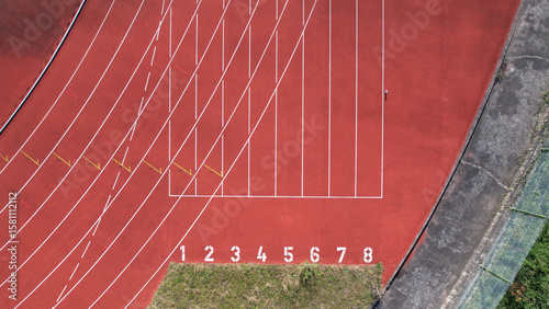 Viana do Castelo, Portugal, December 18, 2021: View of the Manuela Machado Municipal Stadium. Eight empty red tracks for running sports with tartan track of synthetic rubber on the athletic stadium.