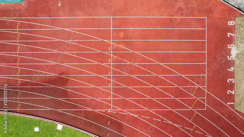 Aerial view of the Manuela Machado Municipal Stadium in Viana do Castelo, Portugal. Eight empty red tracks for running sports with tartan track of synthetic rubber on the athletic stadium.