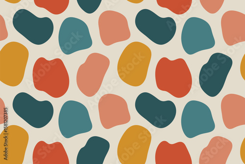Seamless pattern with abstract shapes in retro colors for textile design.