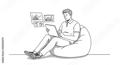 A young businessman analyzing financial data charts on his laptop while sitting comfortably on a beanbag chair in a modern workspace.