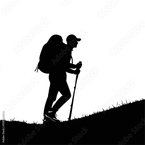 Silhouette of a hiker walking uphill with backpack and trekking poles