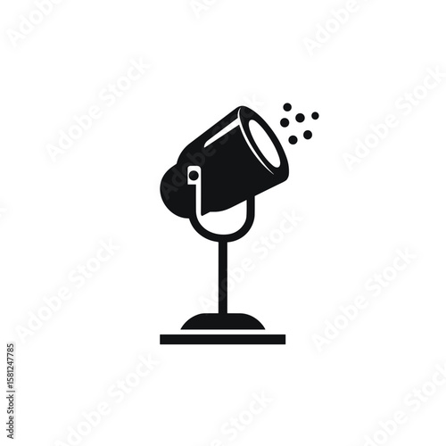 A black and white illustration of a spotlight illuminating a specific area. The light is on a stand, vector.
