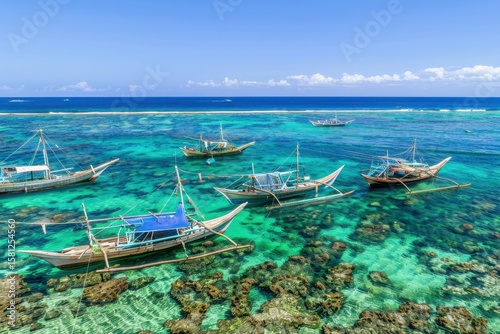 Colorful boats anchored in clear turquoise waters near coral reef under sunny sky