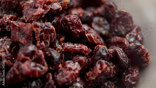 Dried dehydrated red cherries. Dry fruits. Macro shot. Rotation