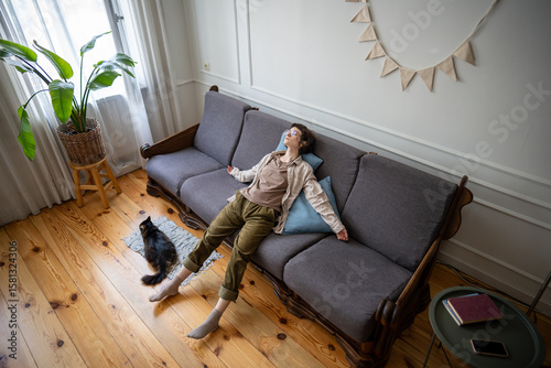 Obraz na plátně Apathetic woman with no power leaning on sofa in depression