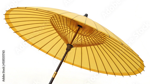 A low angle view of a yellow parasol with a wooden frame and a dark brown handle against white background