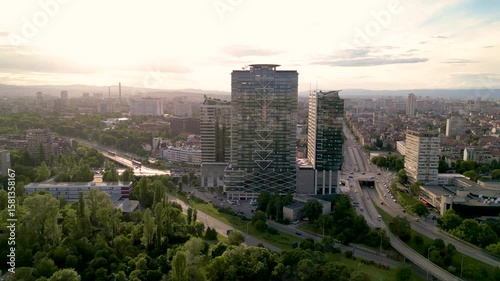 4k Aerial drone footage of Millennium Centre in Sofia, Bulgaria. Skyscraper seen from a drone. Flyover footage of tall building in an urban enrivorment next to a green summer park. Establishing shot.
