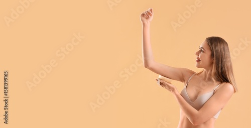 Young woman massaging her a...