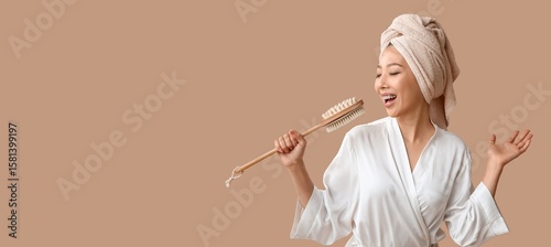 Young Asian woman with mass...