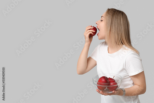Young woman with apples on ...